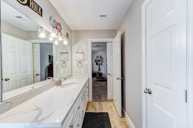 bathroom with vanity and visible vents