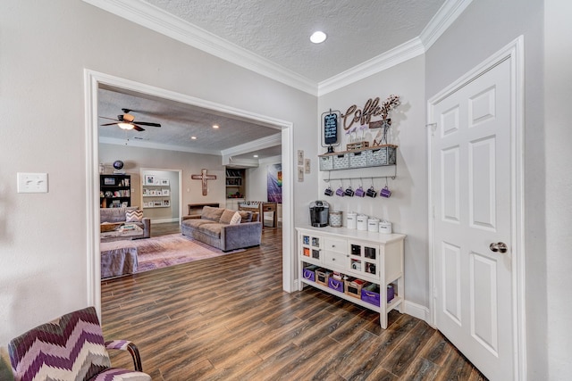 hall featuring crown molding, a textured ceiling, dark wood-style floors, and recessed lighting