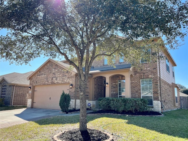traditional-style home with concrete driveway, a front lawn, stone siding, an attached garage, and brick siding