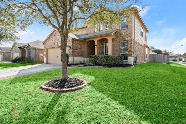 traditional home with brick siding, a garage, a front lawn, and concrete driveway