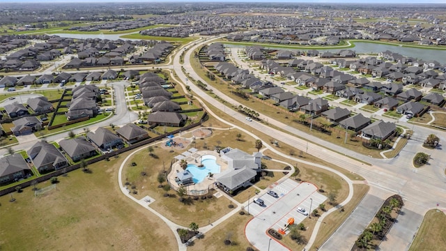 bird's eye view featuring a residential view and a water view