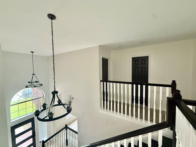 hall featuring an upstairs landing