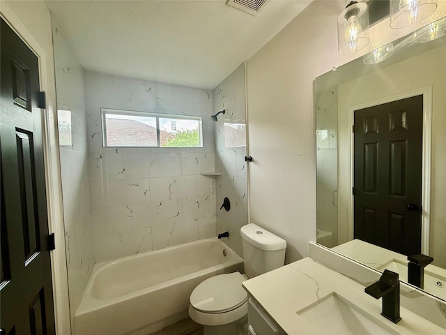 full bathroom with washtub / shower combination, visible vents, toilet, and vanity