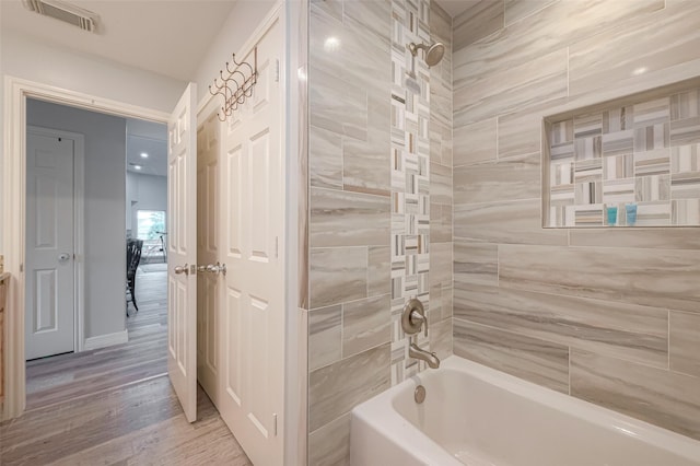 16520 Barbados Way, Jamaica Beach, TX 77554 - full bath with wood finished floors, visible vents, and  shower combination