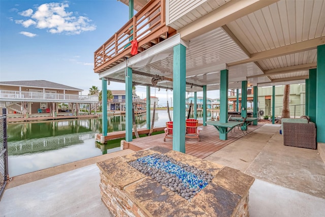 16520 Barbados Way, Jamaica Beach, TX 77554 - view of patio / terrace featuring a dock, a water view, and boat lift