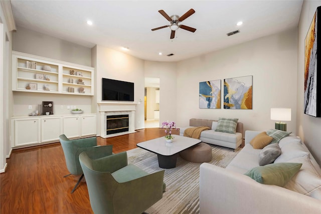 24526 Haigshire Dr, Tomball, TX 77375 - living area with wood finished floors, a ceiling fan, a premium fireplace, and recessed lighting