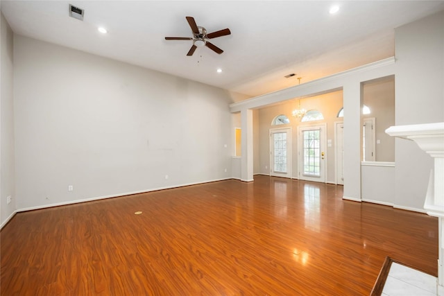 24526 Haigshire Dr, Tomball, TX 77375 - unfurnished living room featuring wood finished floors, ceiling fan, a chandelier, and recessed lighting
