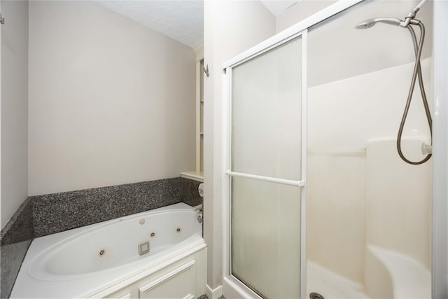 24526 Haigshire Dr, Tomball, TX 77375 - bathroom featuring a stall shower and a tub with jets