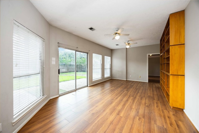 24526 Haigshire Dr, Tomball, TX 77375 - unfurnished living room with light wood-type flooring and a ceiling fan