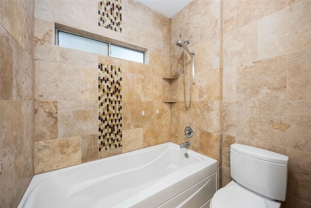 24526 Haigshire Dr, Tomball, TX 77375 - bathroom featuring shower / tub combination and tile walls