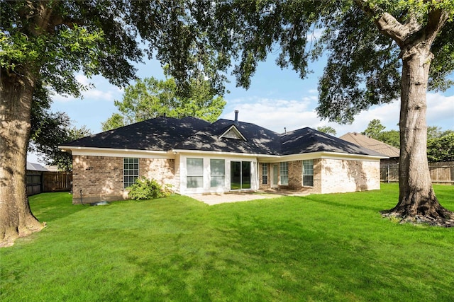 24526 Haigshire Dr, Tomball, TX 77375 - rear view of property featuring a fenced backyard and brick siding