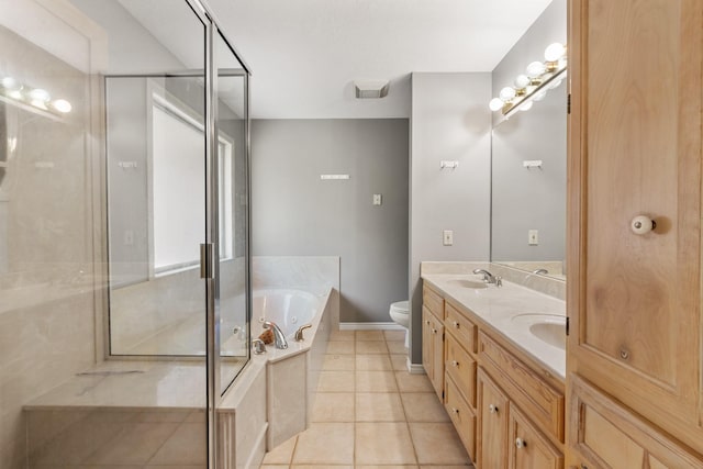 bathroom with tile patterned floors, a sink, double vanity, a stall shower, and a whirlpool tub