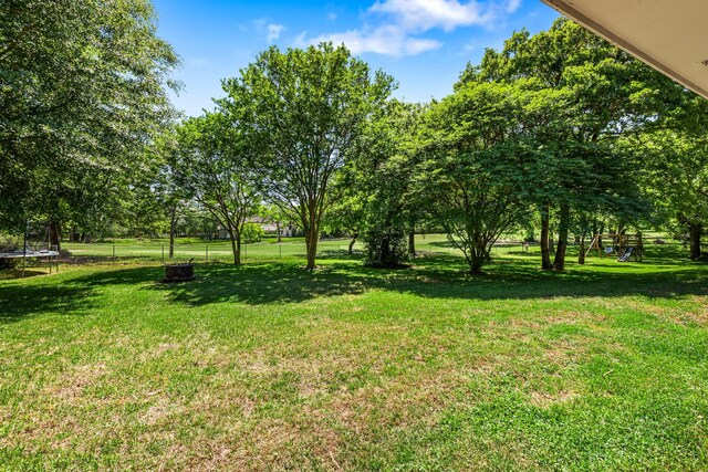 view of yard featuring a trampoline