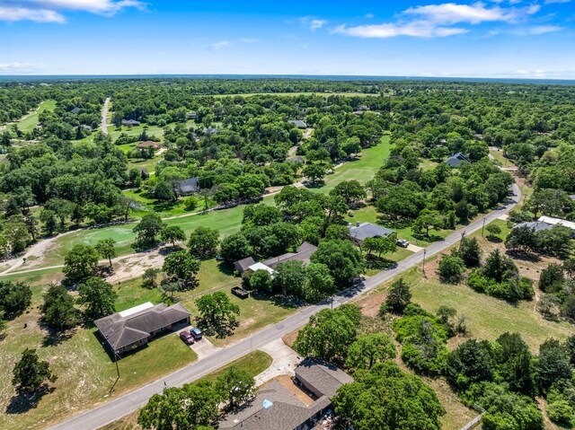drone / aerial view featuring a view of trees
