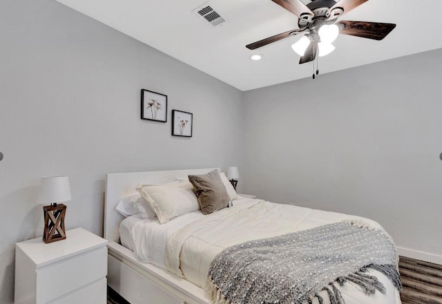 bedroom with visible vents, baseboards, recessed lighting, wood finished floors, and ceiling fan