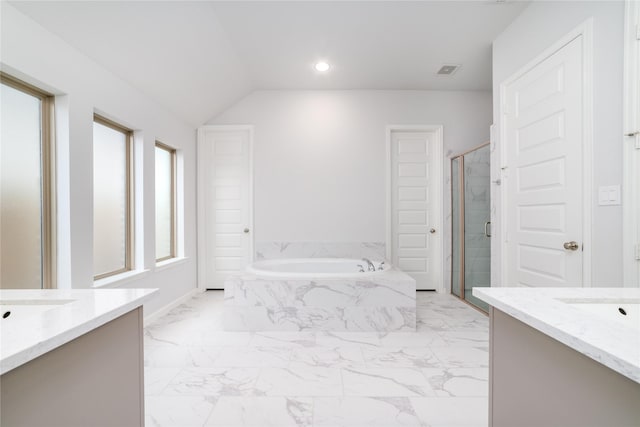 10419 Rigel Ridge Way, Richmond, TX 77406 - full bathroom with two vanities, marble finish flooring, a garden tub, a shower stall, and lofted ceiling