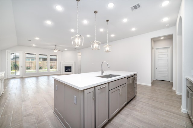 10419 Rigel Ridge Way, Richmond, TX 77406 - kitchen with a sink, gray cabinets, stainless steel dishwasher, a ceiling fan, and light countertops