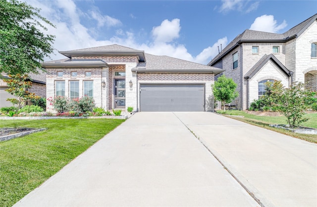10419 Rigel Ridge Way, Richmond, TX 77406 - view of front of house featuring brick siding, concrete driveway, a front yard, an attached garage, and roof with shingles