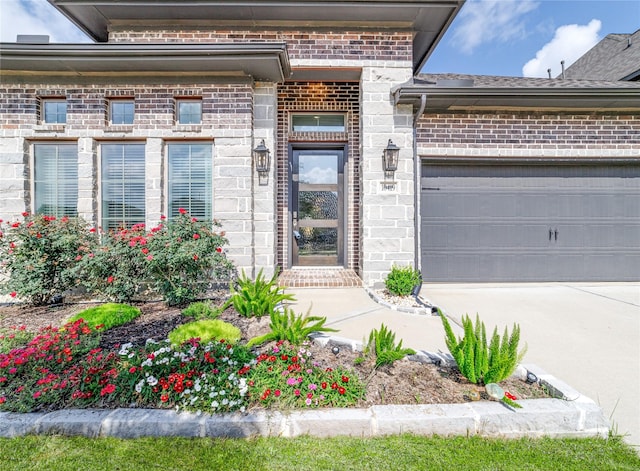 10419 Rigel Ridge Way, Richmond, TX 77406 - doorway to property with brick siding, a garage, and concrete driveway