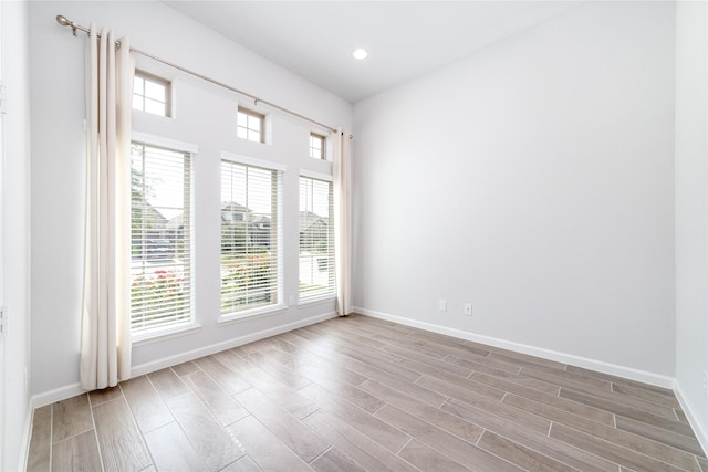10419 Rigel Ridge Way, Richmond, TX 77406 - empty room featuring baseboards, wood finished floors, and recessed lighting