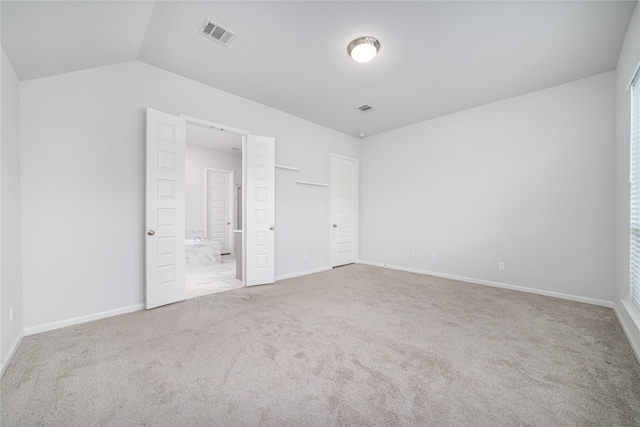 10419 Rigel Ridge Way, Richmond, TX 77406 - unfurnished bedroom with carpet flooring, lofted ceiling, baseboards, and ensuite bathroom