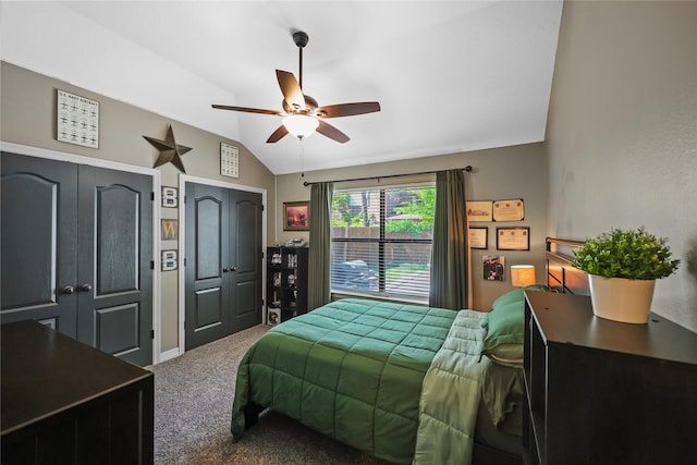 carpeted bedroom featuring ceiling fan and vaulted ceiling