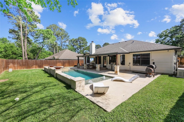 back of property featuring a ceiling fan, a chimney, a fenced backyard, a yard, and a patio