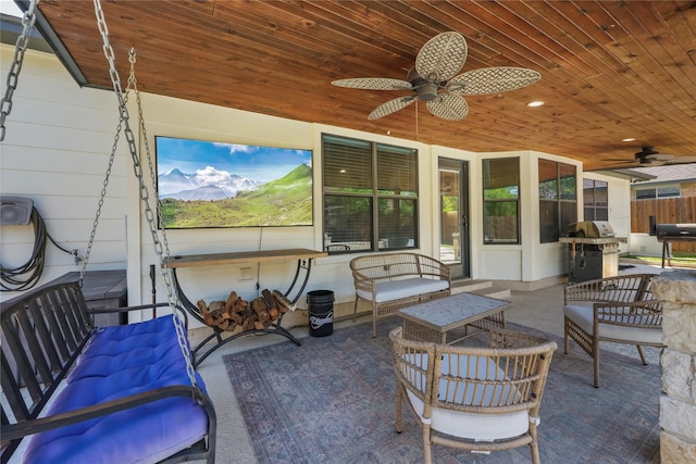 view of patio / terrace with grilling area, ceiling fan, and an outdoor living space