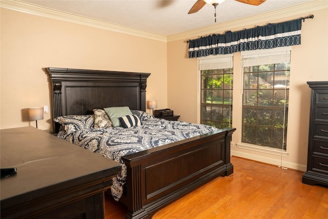 13710 Casaba Ct, Cypress, TX 77429 - bedroom featuring light wood-style flooring, baseboards, ornamental molding, and a ceiling fan