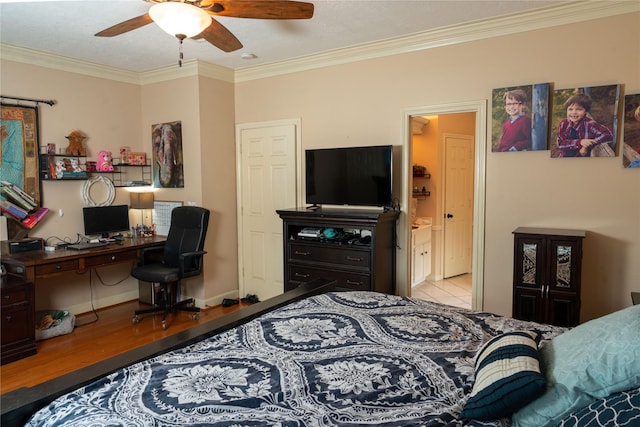 13710 Casaba Ct, Cypress, TX 77429 - bedroom featuring crown molding, wood finished floors, ensuite bathroom, ceiling fan, and baseboards