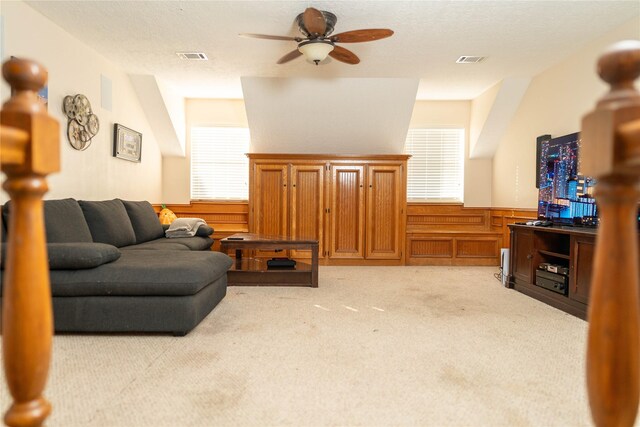 13710 Casaba Ct, Cypress, TX 77429 - living room with ceiling fan, visible vents, a wainscoted wall, and light carpet
