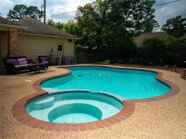 13710 Casaba Ct, Cypress, TX 77429 - view of swimming pool featuring a fenced backyard, a pool with connected hot tub, and a patio
