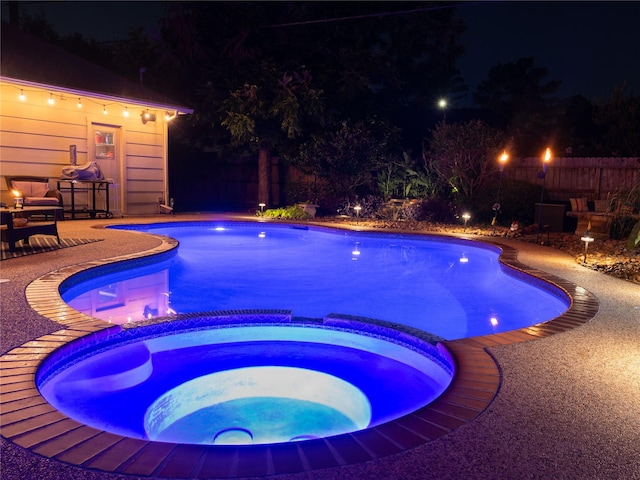 13710 Casaba Ct, Cypress, TX 77429 - pool at night with a patio and a pool with connected hot tub