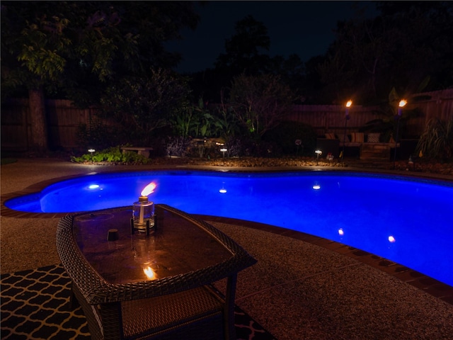 13710 Casaba Ct, Cypress, TX 77429 - pool at night featuring a fenced backyard and an outdoor pool