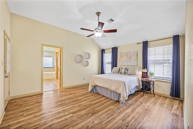 3226 Glen Forest Rd, Montgomery, TX 77356 - bedroom featuring wood finished floors, lofted ceiling, baseboards, and multiple windows