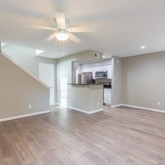 unfurnished living room with light wood-type flooring, baseboards, visible vents, recessed lighting, and a ceiling fan