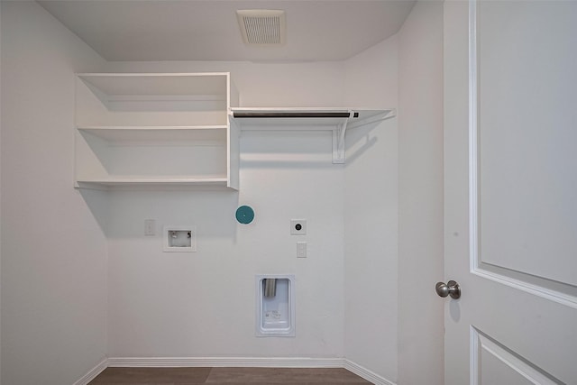 laundry area with hookup for an electric dryer, visible vents, baseboards, laundry area, and washer hookup