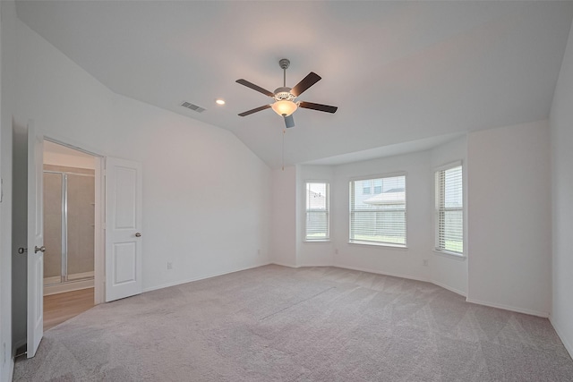 spare room with baseboards, a ceiling fan, visible vents, and carpet