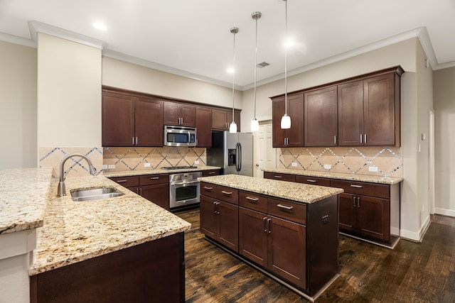 4205 Dickson St, Houston, TX 77007 - kitchen with stainless steel appliances, a sink, dark wood-type flooring, crown molding, and dark brown cabinetry