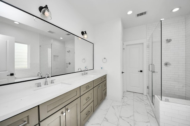full bathroom featuring recessed lighting, double vanity, visible vents, a sink, and a stall shower