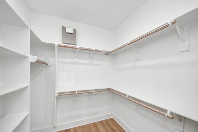 spacious closet with light wood finished floors
