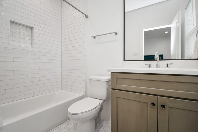 full bath featuring tile patterned floors, toilet, vanity, and bathing tub / shower combination