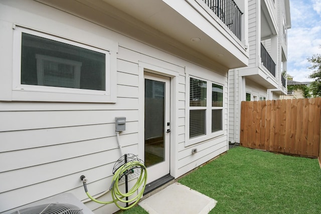 exterior space featuring fence and a yard