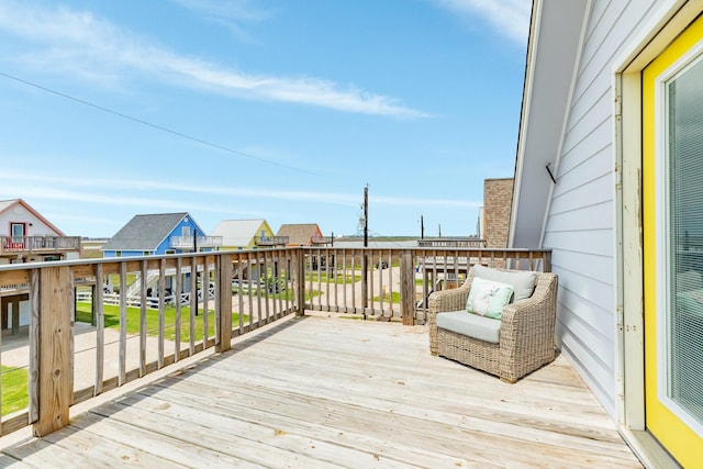 wooden deck featuring a residential view