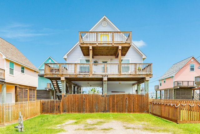 back of property with a fenced backyard and a deck