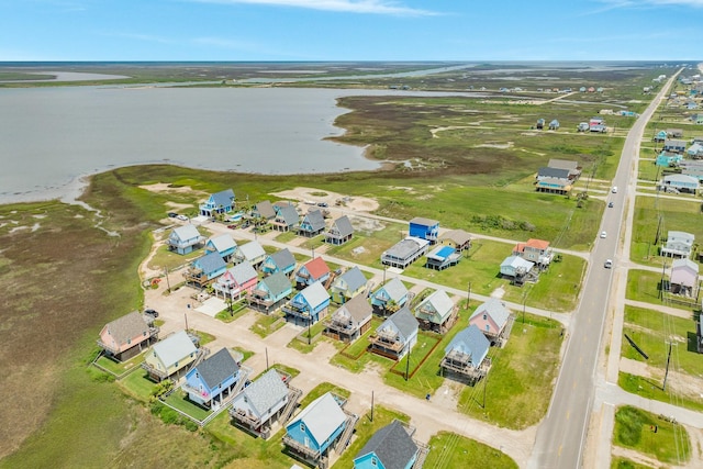birds eye view of property with a water view and a residential view