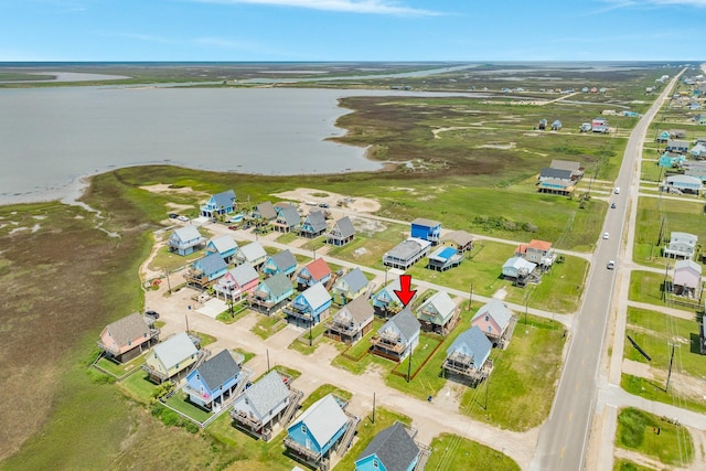 bird's eye view featuring a residential view and a water view