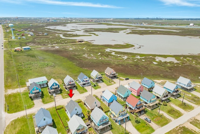 aerial view featuring a residential view and a water view