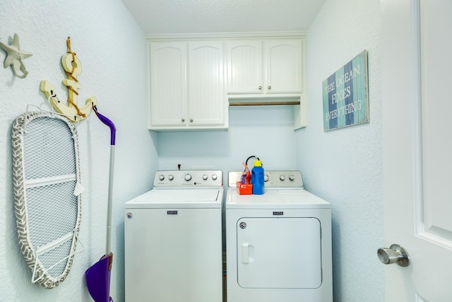 laundry room featuring cabinet space and washer and dryer