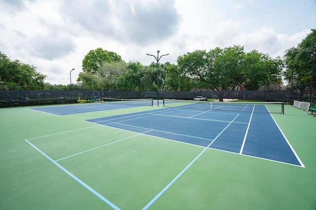 view of sport court featuring community basketball court and fence